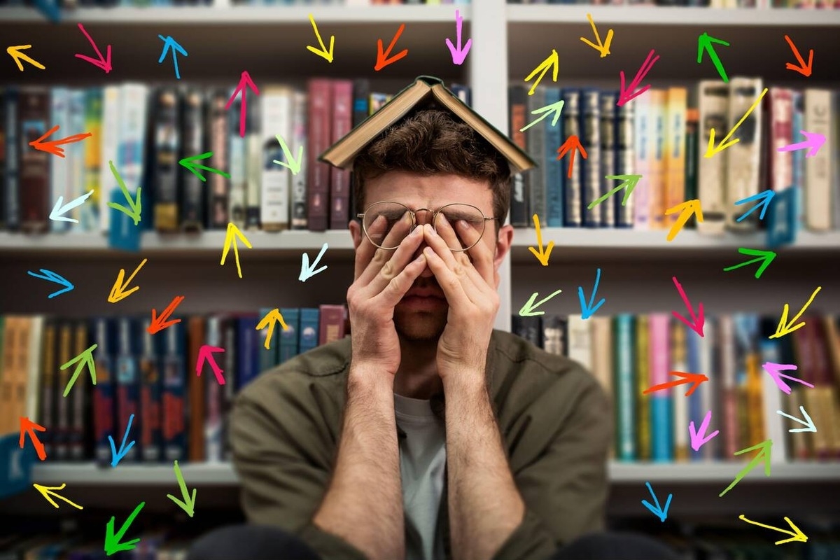 Tired university student has difficulty to study